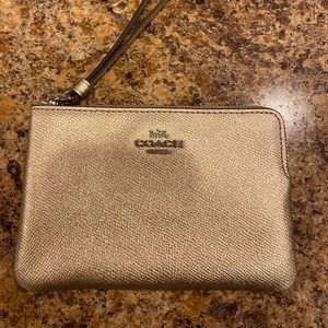Small Coach wristlet gold metallic color